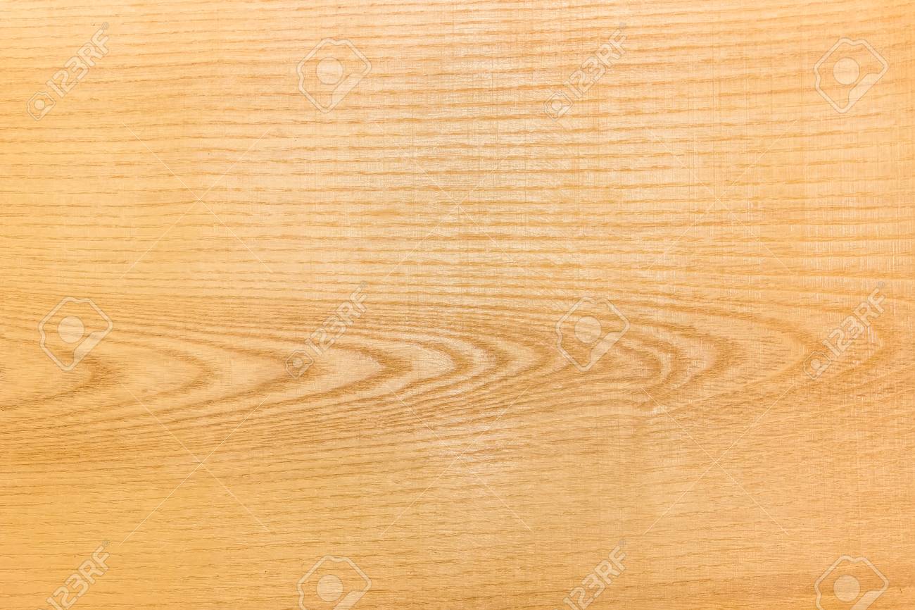 Background of wooden surface made of the ash-tree plank after primary coarse processing
